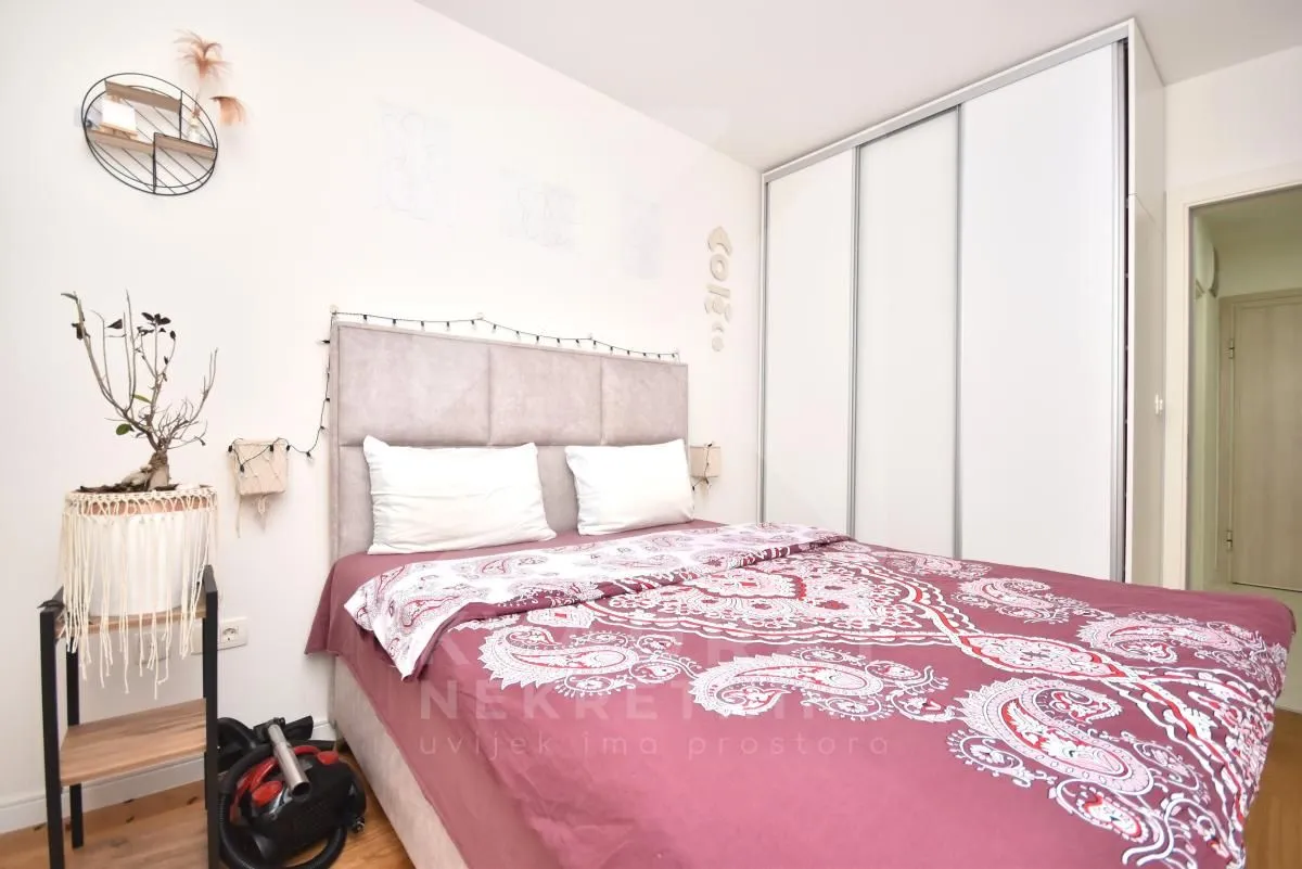 Bedroom with a double bed and a built-in wardrobe.