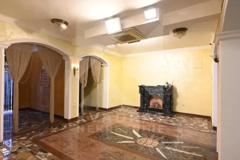 Spacious living room with a fireplace and marble floor. - image 4