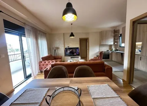 Living room connected to the dining area and kitchen, with access to the terrace. - image 15