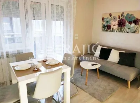 Living room with dining area and sofa. - image 4