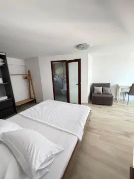 Bright bedroom with a double bed and an en-suite bathroom. - image 6