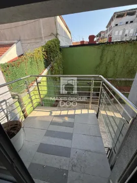 Small tiled balcony with metal railing and a view of the courtyard and surrounding buildings. - image 18