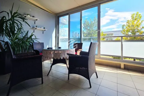 Enclosed terrace with seating furniture and a view of the surroundings. - image 9