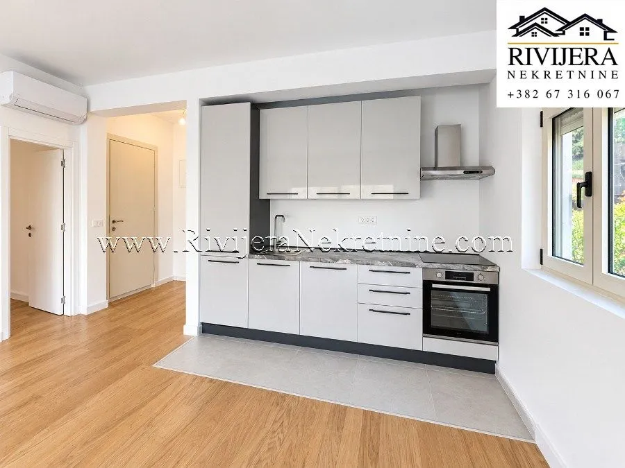 Modern kitchen with built-in cabinetry and appliances.