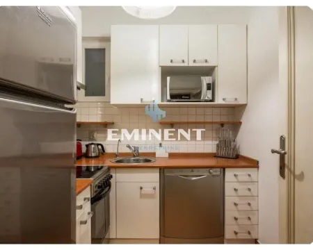 Compact equipped kitchen with white cabinetry and household appliances. - image 17