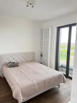 Bright bedroom with a double bed and access to the balcony. - image 16