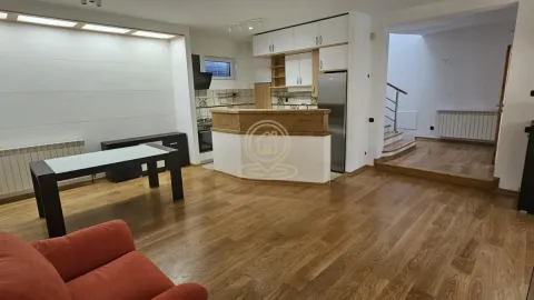 Open space layout featuring a kitchen, dining area, and living room. - image 6
