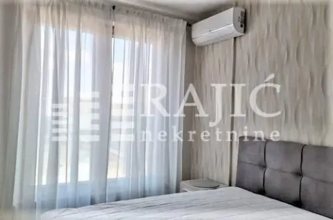 Furnished bedroom with a bed and an air conditioner. - image 5