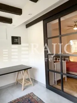 View from the hallway through glass sliding doors into the bedroom. - image 12