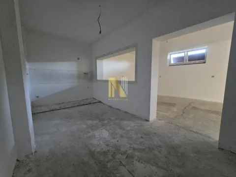 Unfurnished space under construction with an open passage and a window. - image 6