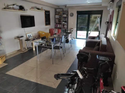 Living room with a dining table. - image 7