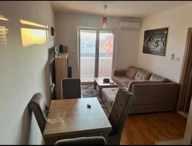 Living room with a dining area and sofa set.