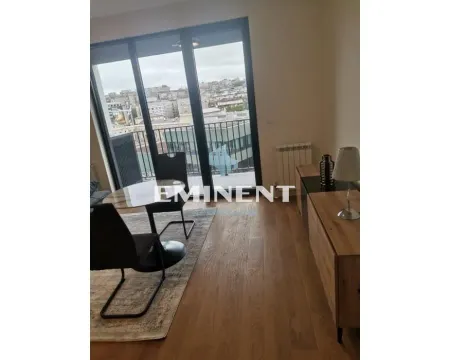 Living room with dining table and access to the terrace. - image 11