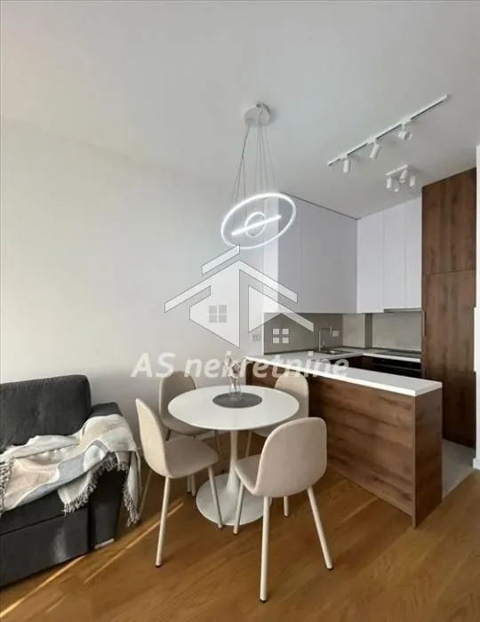 Modern kitchen with dining area and part of the living room.