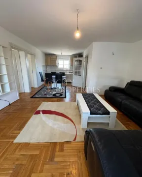 Spacious living room connected to the dining area and kitchen. - image 3