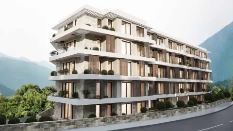 Spoljašnji izgled moderne stambene zgrade sa terasama i pogledom na planine. - image 7