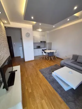 Living room with dining area and kitchen in the background. - image 7