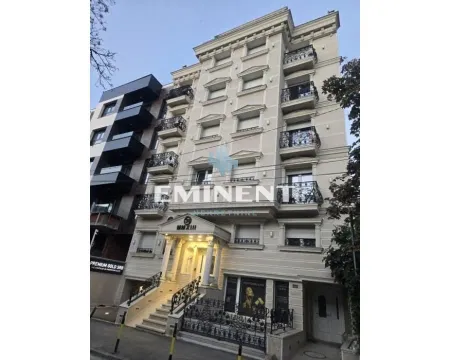 Exterior view of the residential building with facade details and entrance. - image 12