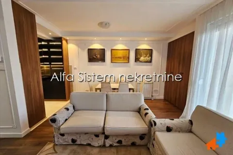 Living room with a sofa set and dining area in the background. - image 5