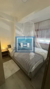 Bedroom with a double bed and a mosquito net. - image 10