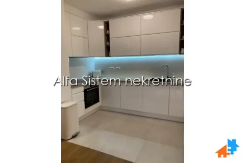 Modern white kitchen with built-in units and LED lighting. - image 6