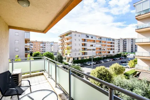 View from the balcony overlooking the neighborhood and parking lot. - image 15