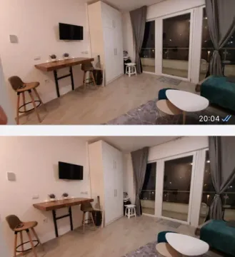 Living room with a dining table and access to the terrace. - image 4