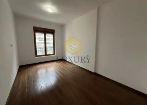 Empty room with wooden flooring and a window. - image 3