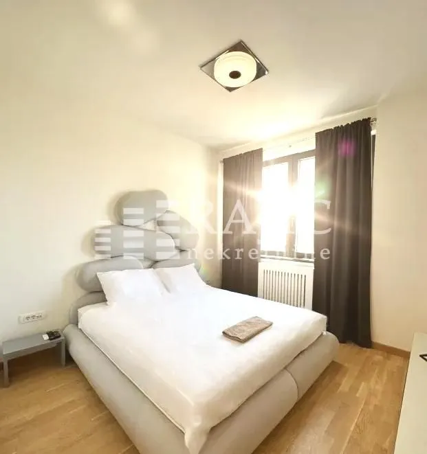 Furnished bedroom with a double bed.