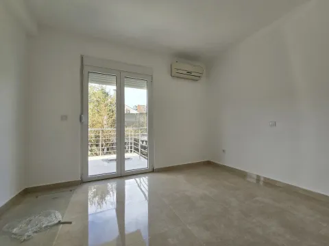 Empty room with tiled flooring and access to a terrace. - image 31