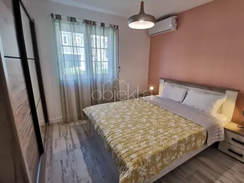 Furnished bedroom with a double bed, wardrobe, and a window. - image 10