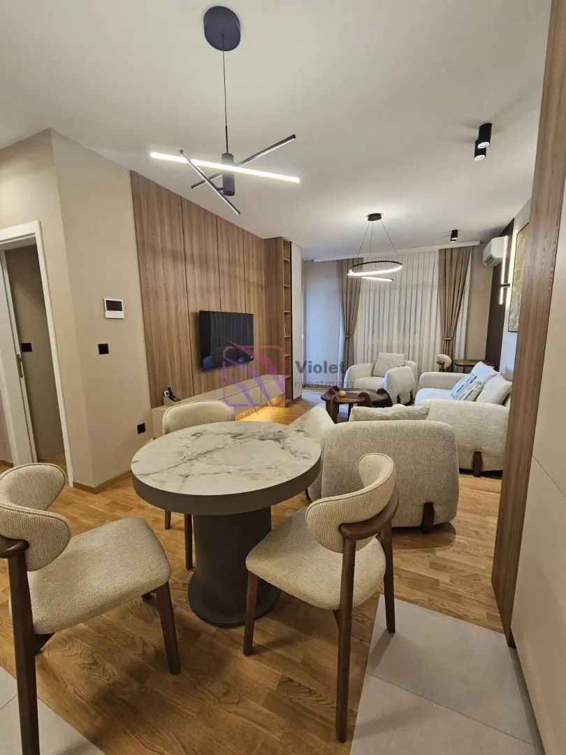 Spacious living room with a dining table and modern furniture.
