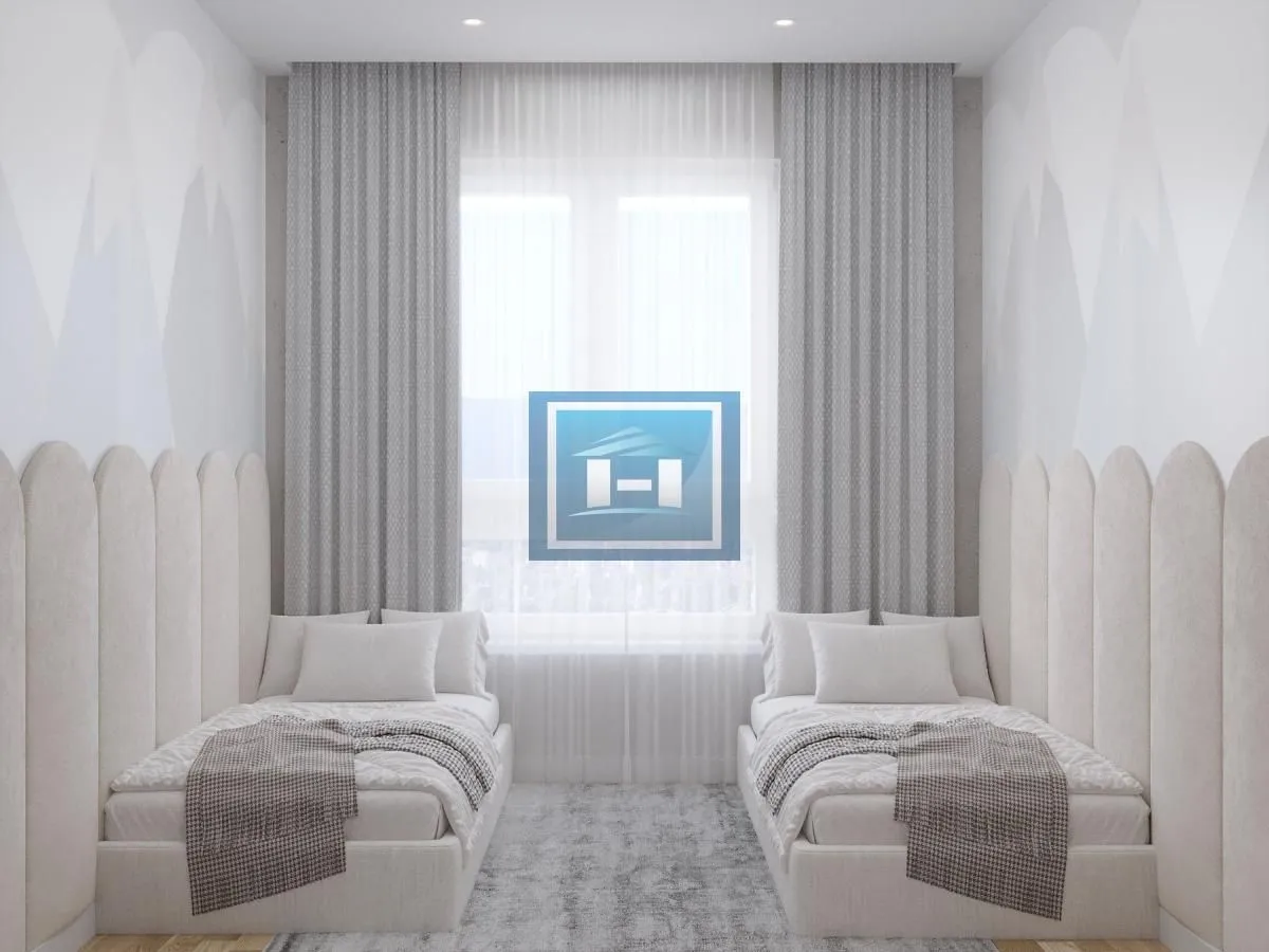 Bedroom with two single beds and a window.