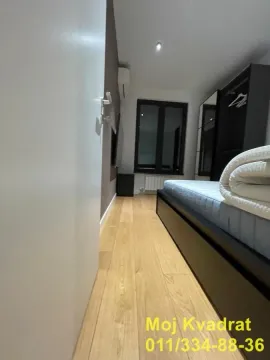 Smaller bedroom with a bed and a wardrobe. - image 11