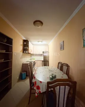 Kitchen with a dining table and chairs. - image 8