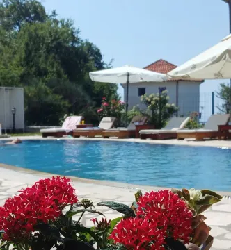 Swimming pool with sun loungers and parasols in the courtyard. - image 8