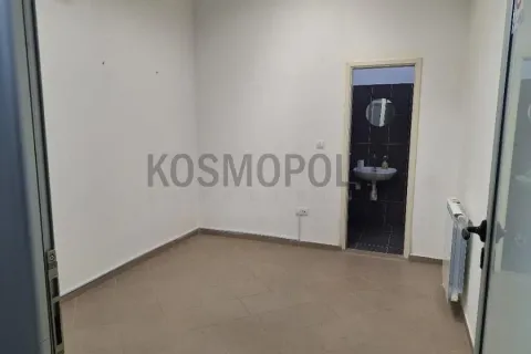 Empty room with a view of a small bathroom. - image 2