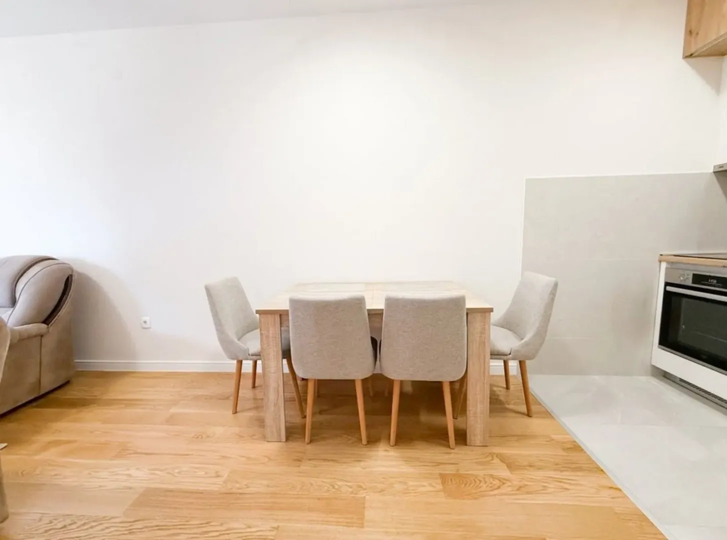 Dining table with chairs in the kitchen area.