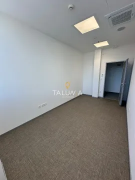 Empty office space with white walls and carpeted flooring. - image 4