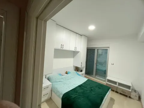 Bedroom with a double bed and fitted wardrobes. - image 8