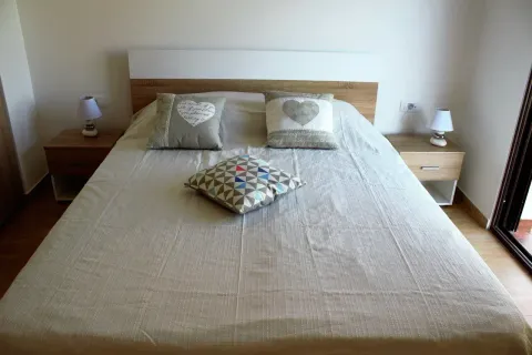 Furnished bedroom with a double bed and nightstands. - image 7