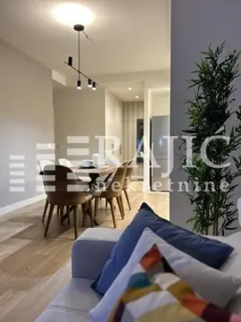 Living room with dining area and modern lighting. - image 12