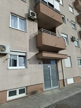 Exterior view of a residential building entrance. - image 2