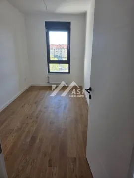 Empty room with parquet flooring and a window. - image 4