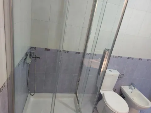 Bathroom with a shower cabin, toilet and bidet. - image 13