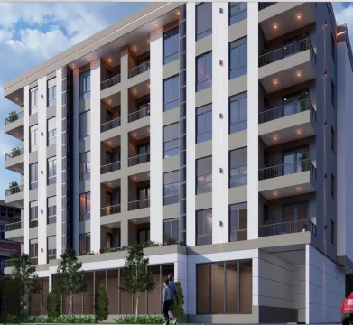 Exterior of a modern residential building with balconies and a landscaped ground floor. - image 2