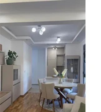 Living room with dining area and a view of the kitchen. - image 5