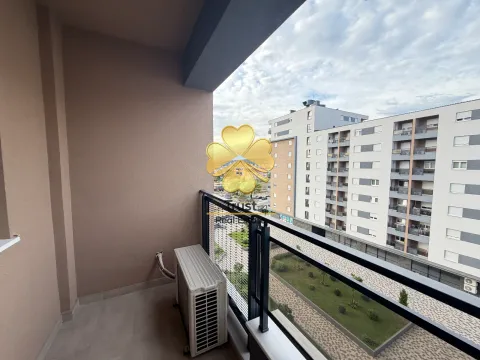 Covered balcony with a view of neighboring buildings and courtyard. - image 9