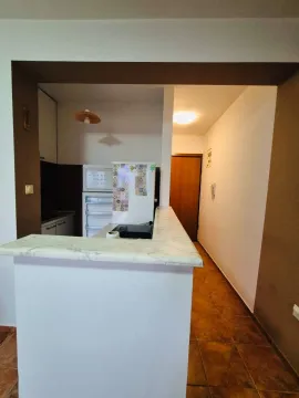 View of the kitchen and breakfast bar from the hallway. - image 3