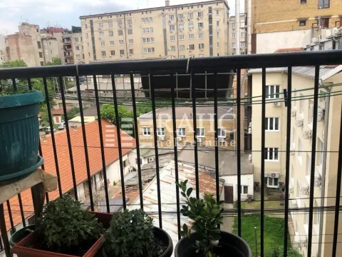 View from the balcony overlooking surrounding buildings and courtyard. - image 16